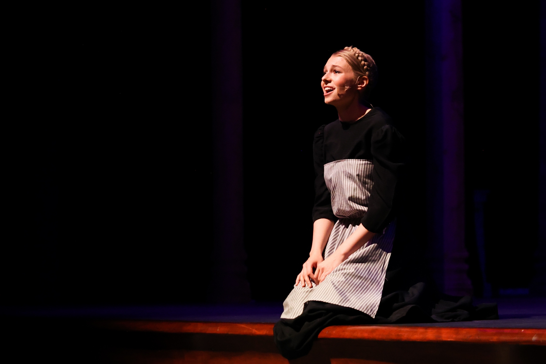 Sydnee Glover, whitworth student, as main character, Maria Rainer, sits front stage at the dress rehearsal of "Sound of Music", Thursday, Oct. 13, 2022, in Spokane, Wash. | Mario Gonzalez/The Whitworthian