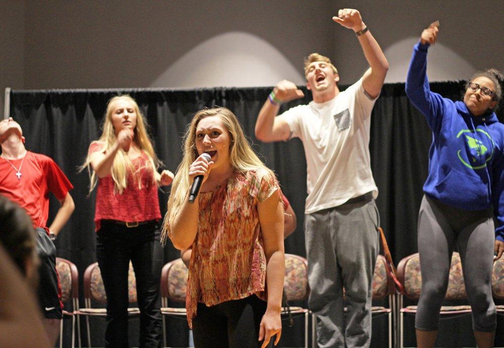 Students hypnotized by professional hypnotist during Homecoming week