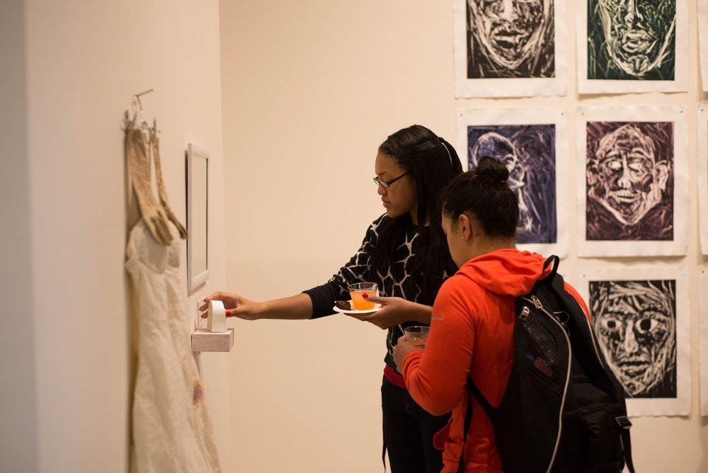 Freshman Jira Hammond interprets senior Annie Feuerstein’s piece titled “Set Time, Face Self”.