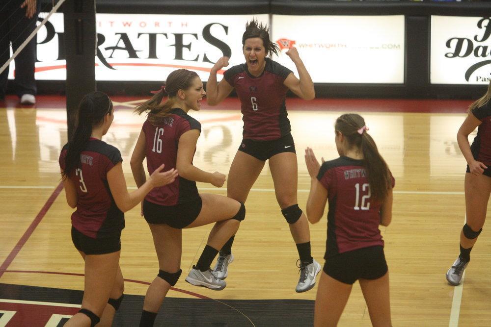 Whitworth women celebrating a powerful spike from senior Briauna Stadeli