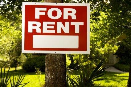 For Rent sign in front of a house.