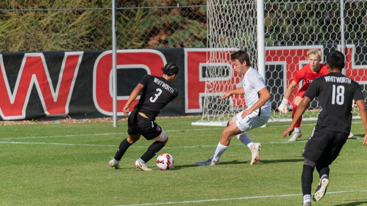 Dominic Gusman (WU #3) drives towards the goal