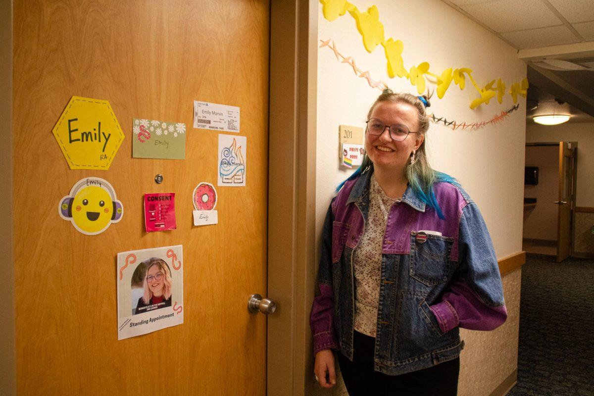 Emily Marvin a Senior Biology and English Writing Major Decorates her door according to her hall Theme: Worm