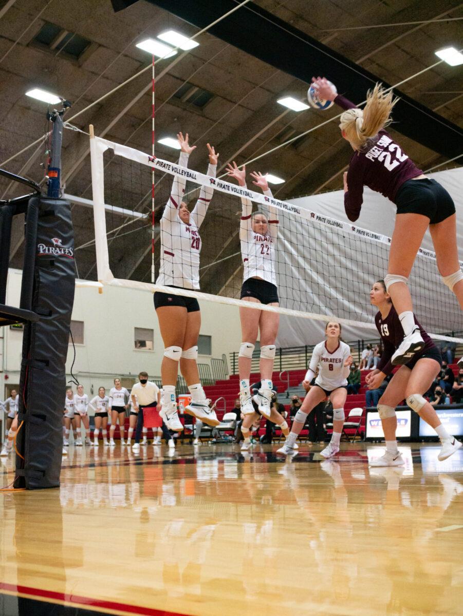 Logan Spencer (20), Cassidy Franklin (22), Volleyball game at the Fieldhouse