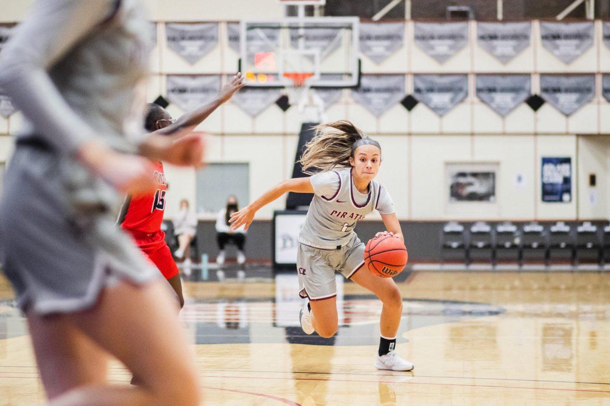 Macy Morales (1) fast break to the hoop againsit Danasia Allison (13) during NCAA Division III basketball at the Fieldhouse. Friday, Nov. 12,2021, in Spokane Washington.  | Mario Gonzalez/The Whitworthian