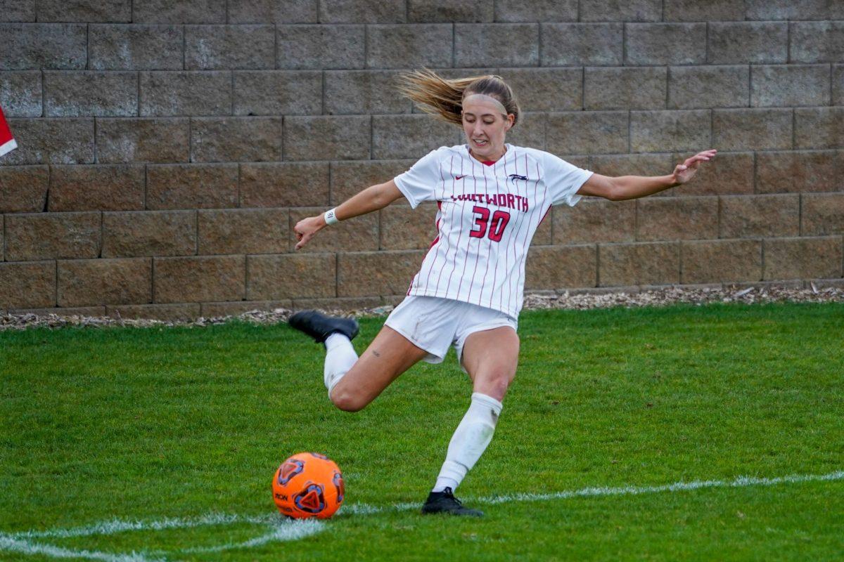 #30 Baylee Trejo crosses the ball in for a corner during a NCAA womens soccer match at Whitworth University against Whitman, Wednesday, Oct. 5th 2022, in Spokane, Wash. | Caleb Flegel/The Whitworthian