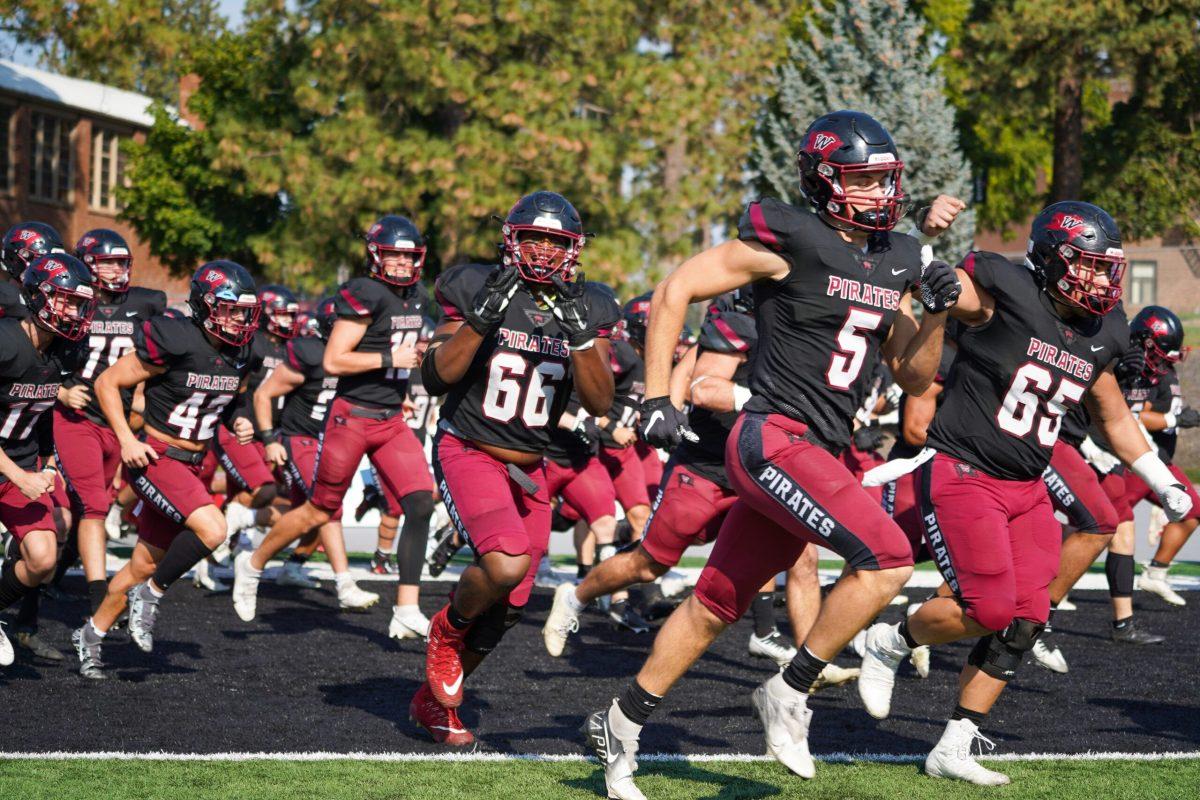 Members of the Whitworth football team run onto the field before a NCAA football game at Whitworth University against Linfield University, Saturday, Oct. 8th 2022, in Spokane, Wash. | Caleb Flegel/The Whitworthian