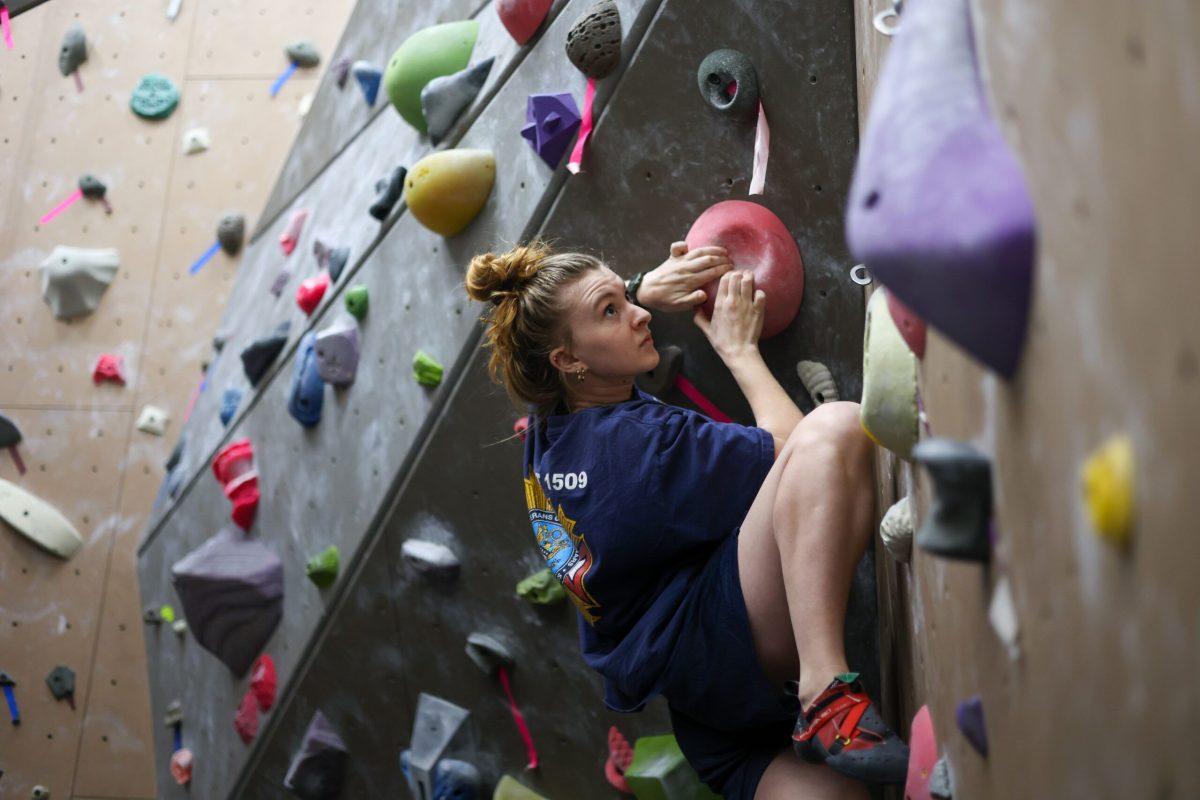 Anna Steere boulders on the off the side of the rock climbing wall at Whitworth University's URec, Spokane, Wash., Friday, Mar. 10, 2023 | Photo by Timara Doyle/ The Whitworthian