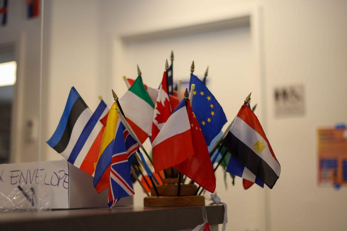 Miniature flags on the front desk inside the ISC building at Whitworth University, Spokane, Wash., Wednesday, Apr. 19, 2023 | Photo by Timara Doyle/ The Whitworthian.
