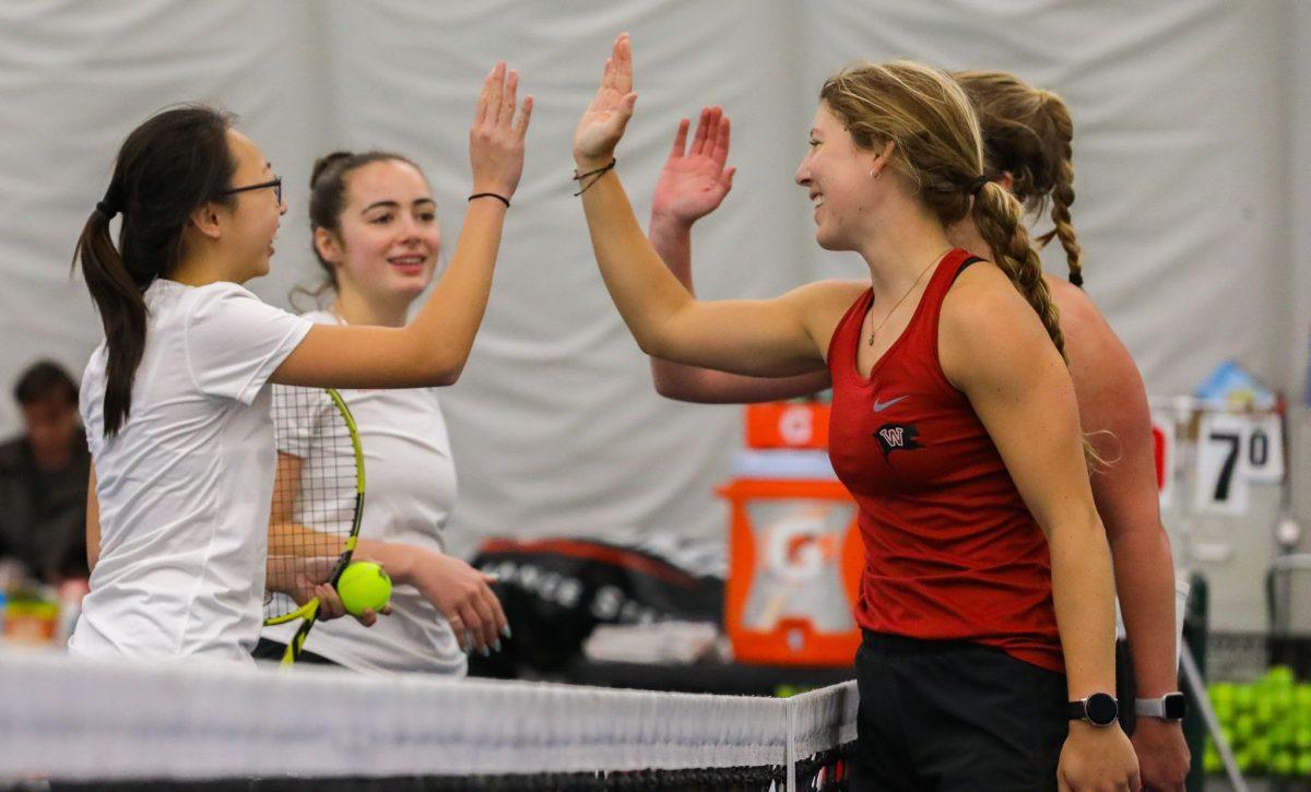 Whitworth’s graduate, Hannah Plank, right, junior Aleah Kert shake hands of their opponents at the tennis match against Lewis and Clark Pioneers at Whitworth University, Saturday, April 9, 2021, in Spokane, Wash. | Hannah Loesch/The Whitworthian