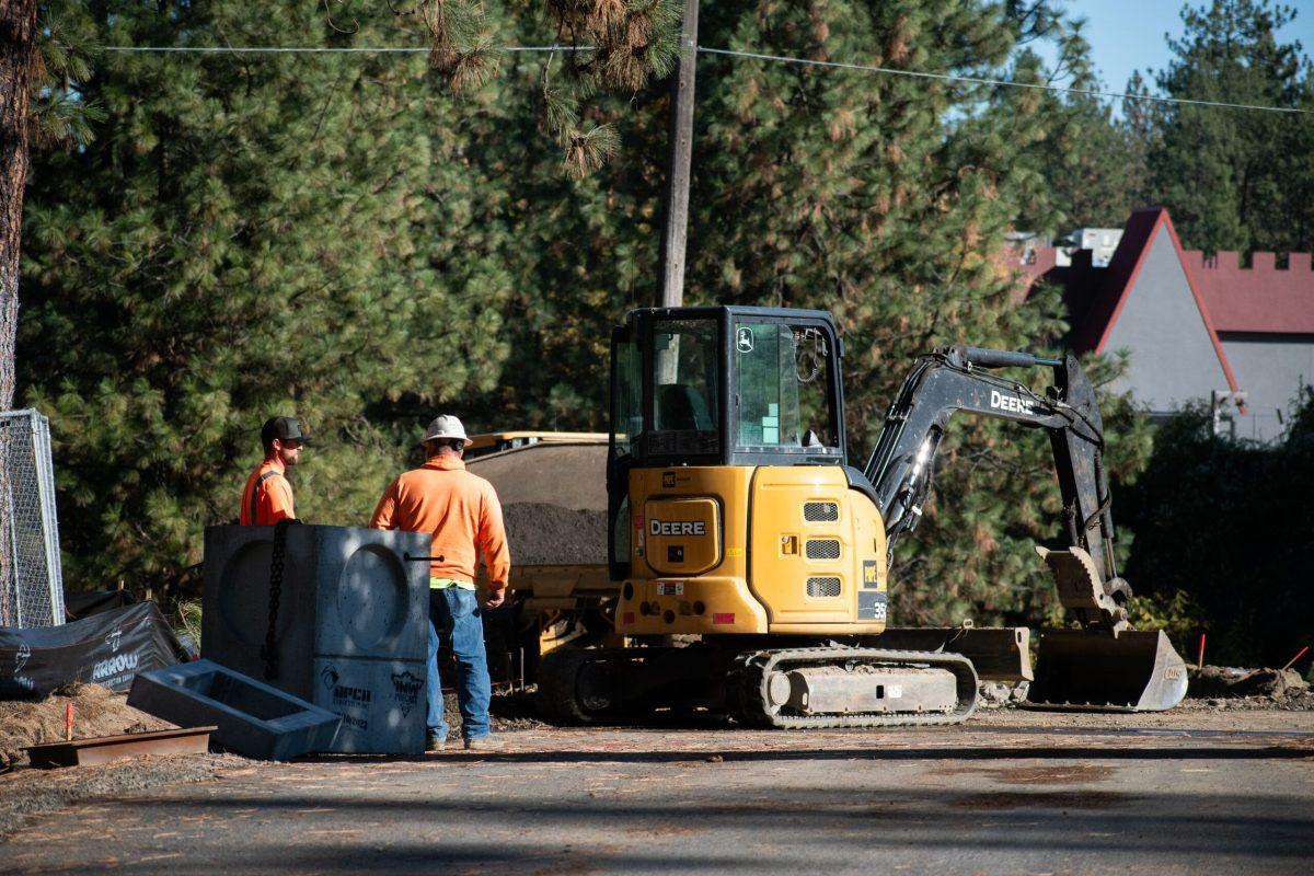 Two workers from Bouten Construction Company work outside of Hawthorne Hall at Whitworth University on Oct. 17, 2023, in Spokane, Wash. | Madison Stoeckler/The Whitworthian