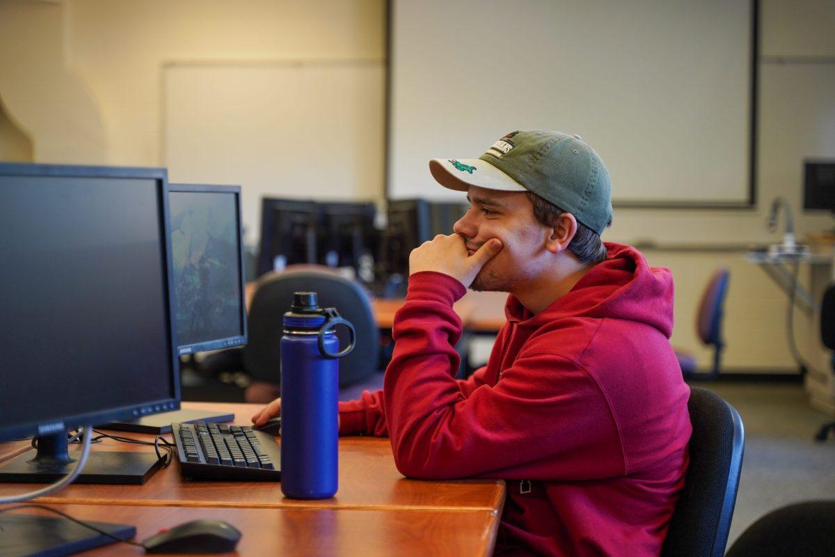 Student Caleb Neale uses a computer in Eric Johnston Science Center, Nov 3, 2023, at Whitworth University in Spokane, Wash. | Caleb Flegel/The Whitworthian