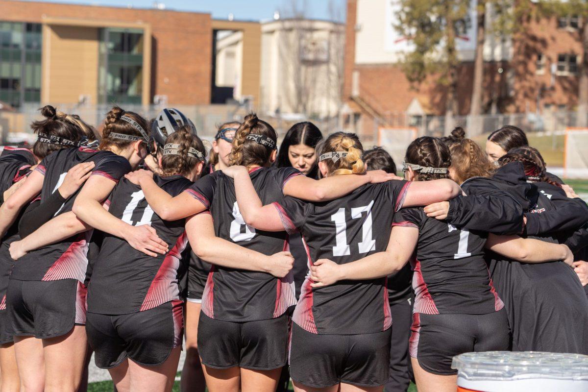 The Whitworth Lacrosse Team huddles before a game against Eastern Oregon University, Saturday, Feb 17, 2024, at Whitworth University in Spokane, Wash. | Caleb Flegel, photo used with permission from Whitworth Athletics