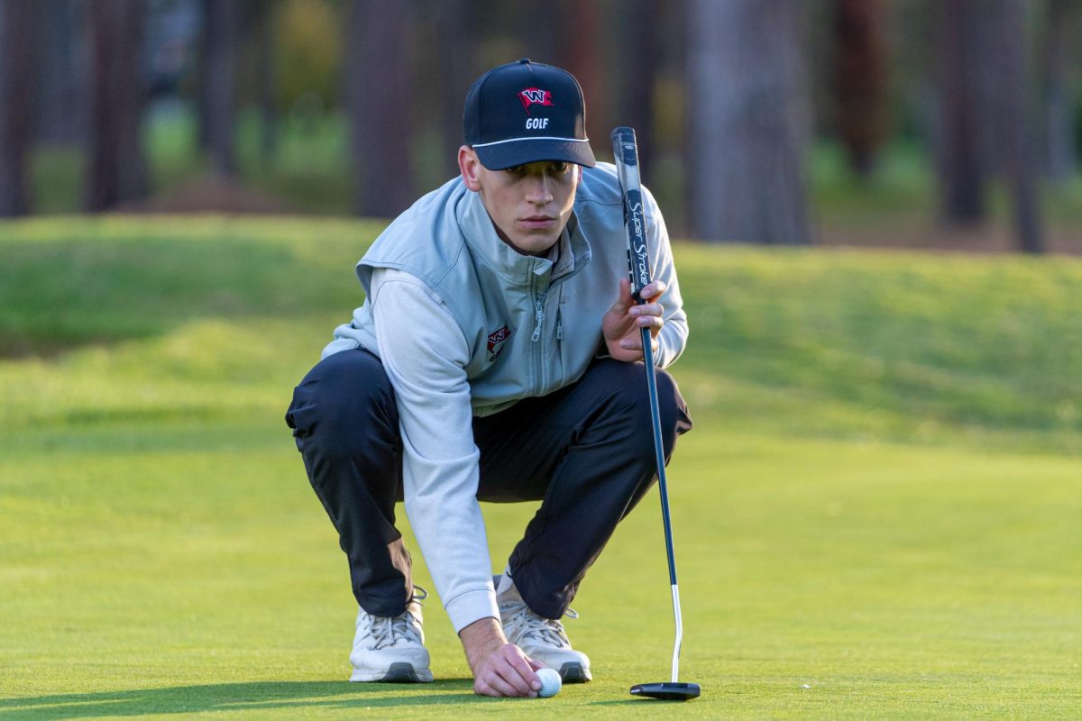 Whitworth golfer Cooper Smith lines up a putt, Thursday, Oct. 17, 2024, in Spokane, Wash. | Caleb Flegel/The Whitworthian