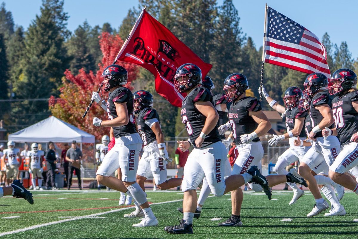 The Whitworth University football team runs onto the field before an NCAA football game against Willamette University, Saturday, Oct. 12, 2024, in Spokane, Wash. | Caleb Flegel/The Whitworthian