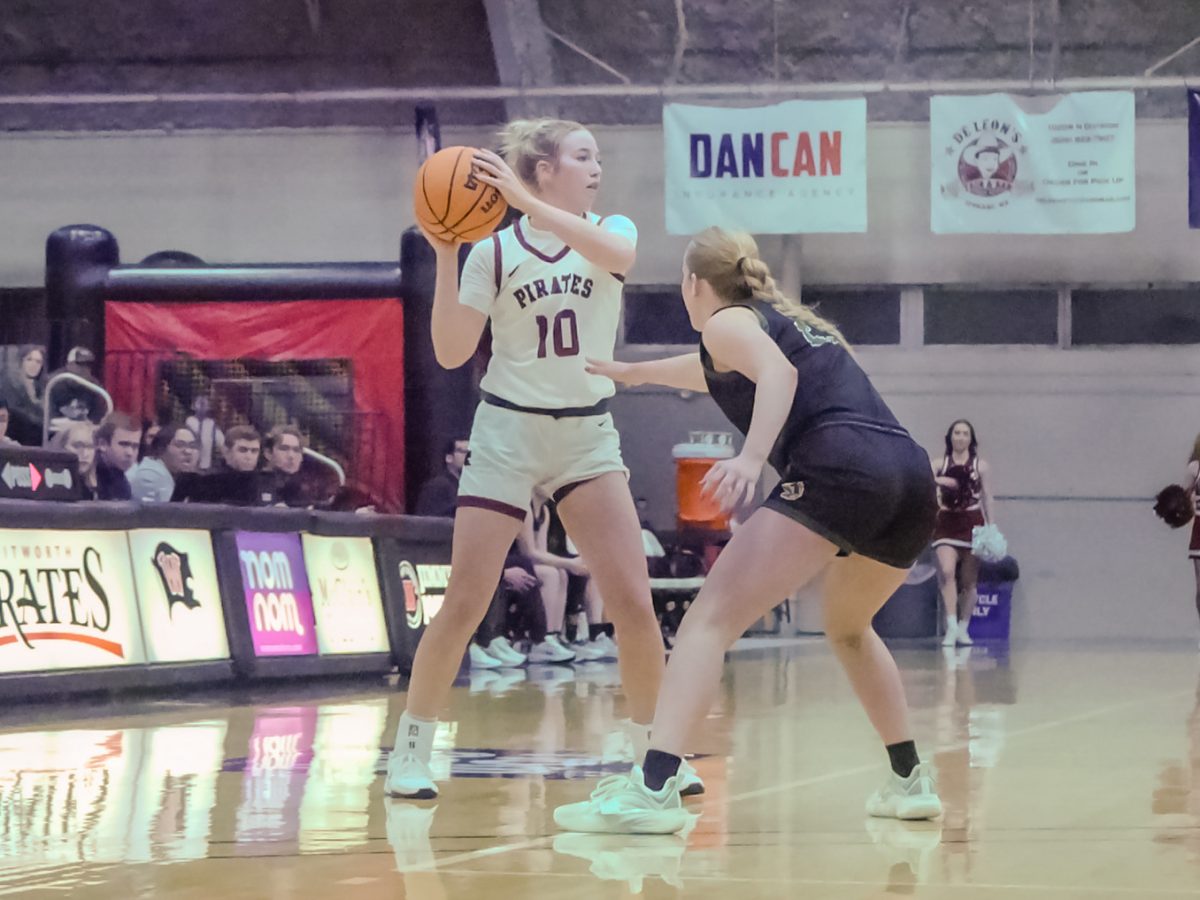 Whitworth guard Mya Bair (10) prepares to throw a pass while being guarded by a Walla Walla University guard in the Fieldhouse at Whitworth University, Nov. 21, 2024, in Spokane, Wash. | Stella Fergin/The Whitworthian