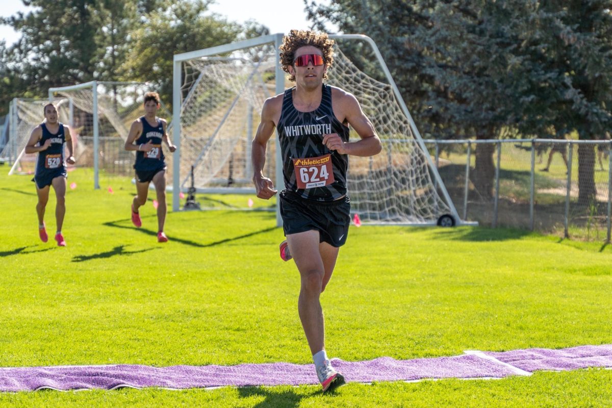 Alex Peters crosses the finish line, Friday, Aug. 30, 2024, at the Inland Northwest Clash Cross Country Meet in Cheney, Wash. | Photo by Caleb Flegel, courtesy of the Whitworth Althetics Department