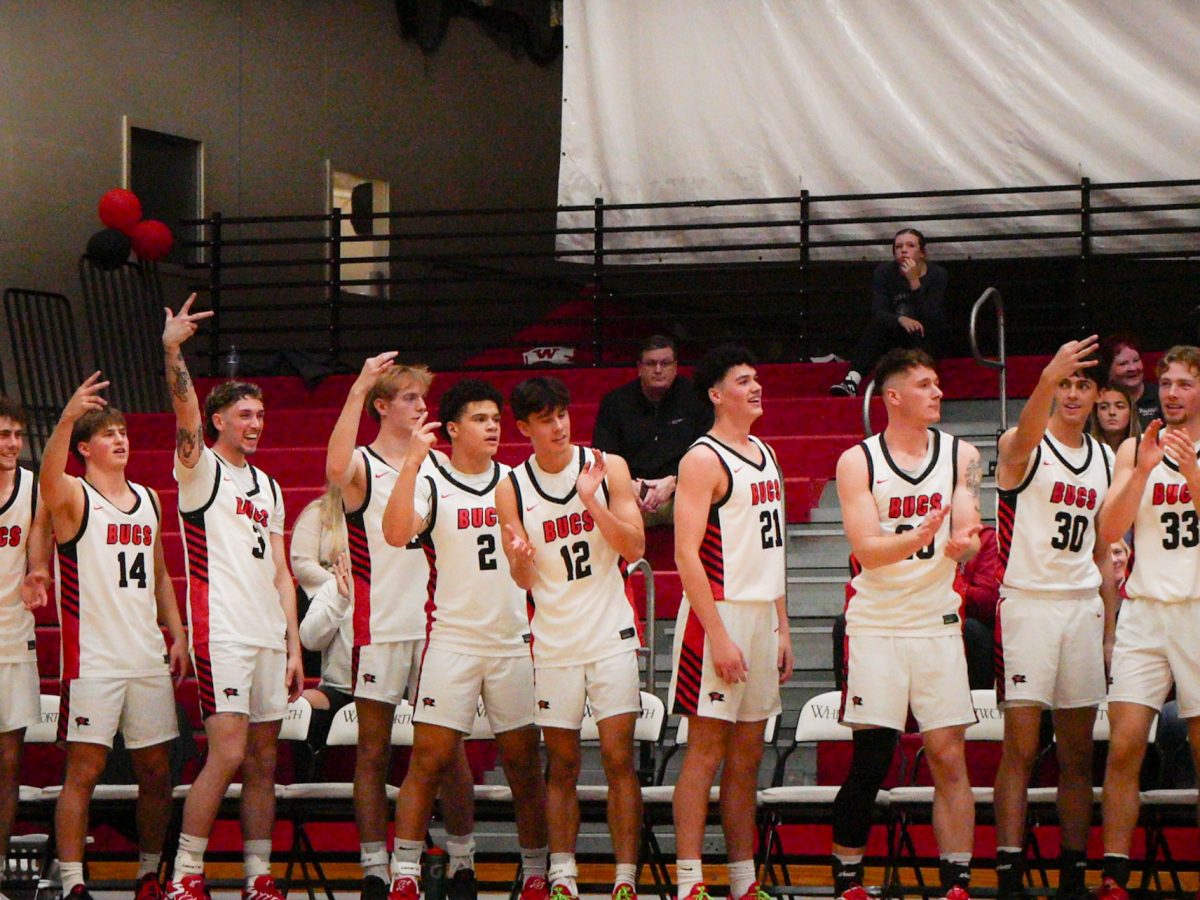 The Whitworth Men’s Basketball team celebrates on the bench after a player makes a three pointer in their non-conference affiliated game against Benedictine in the Fieldhouse at Whitworth University, Thursday, Nov. 14, in Spokane, Wash. | Stella Fergin/The Whitworthian