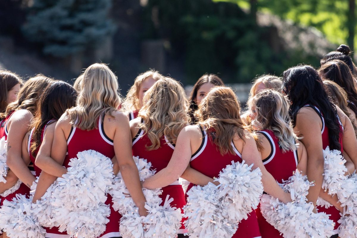 The Whitworth Cheer Team prepares to preform before a football game, Saturday, Sep. 21, 2024, at the Whitworth University Pine Bowl in Spokane, Wash. | Caleb Flegel/The Whitworthian