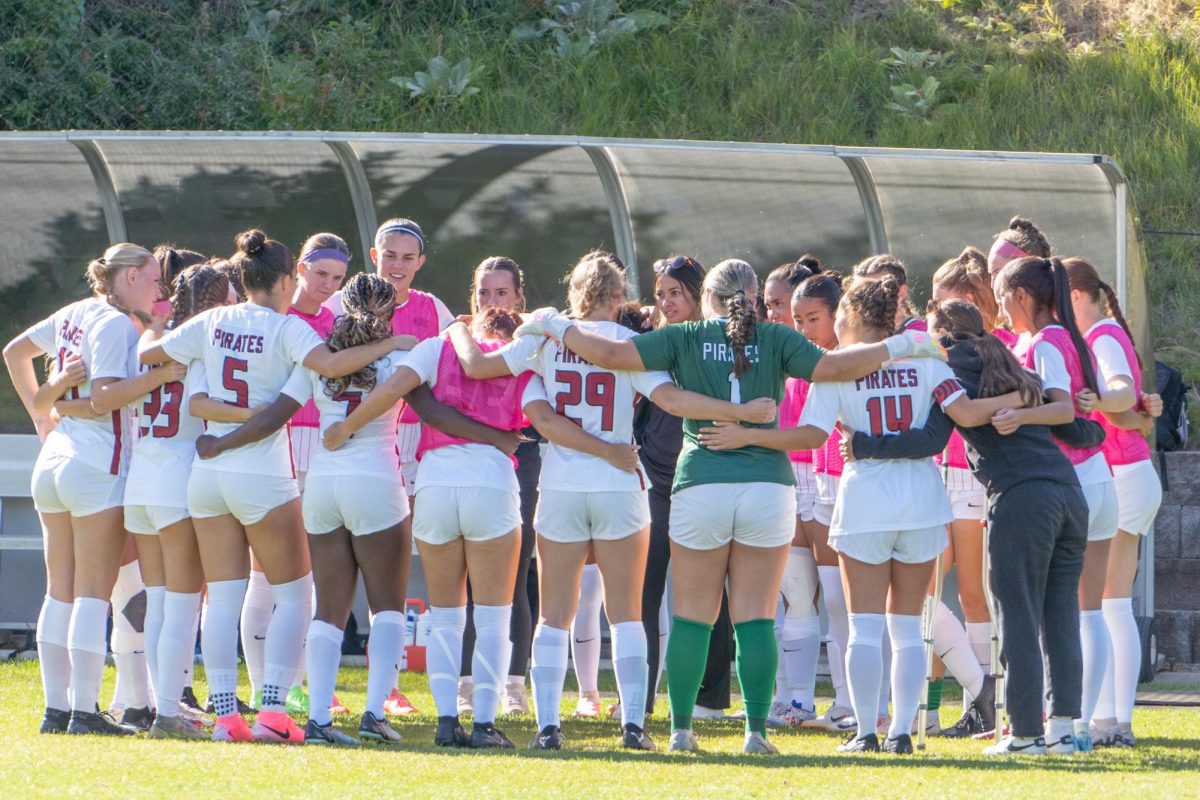 The Whitworth Women's Soccer Team huddles before a match against Lewis & Clark College, Saturday, Oct. 5, 2024, at the Whitworth Soccer Field in Spokane, Wash. | Photo by Caleb Flegel, courtesy of Whitworth Athletics