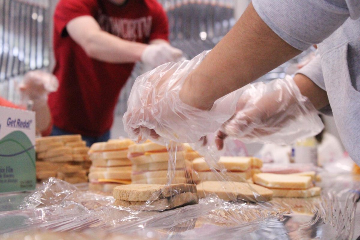 Students of En Christo pack snacks and sandwiches in the Hixson Union Building (HUB) at Whitworth University, Saturday, April 12, 2025, in Spokane, Wash. | Mikaela Butlay/The Whitworthian