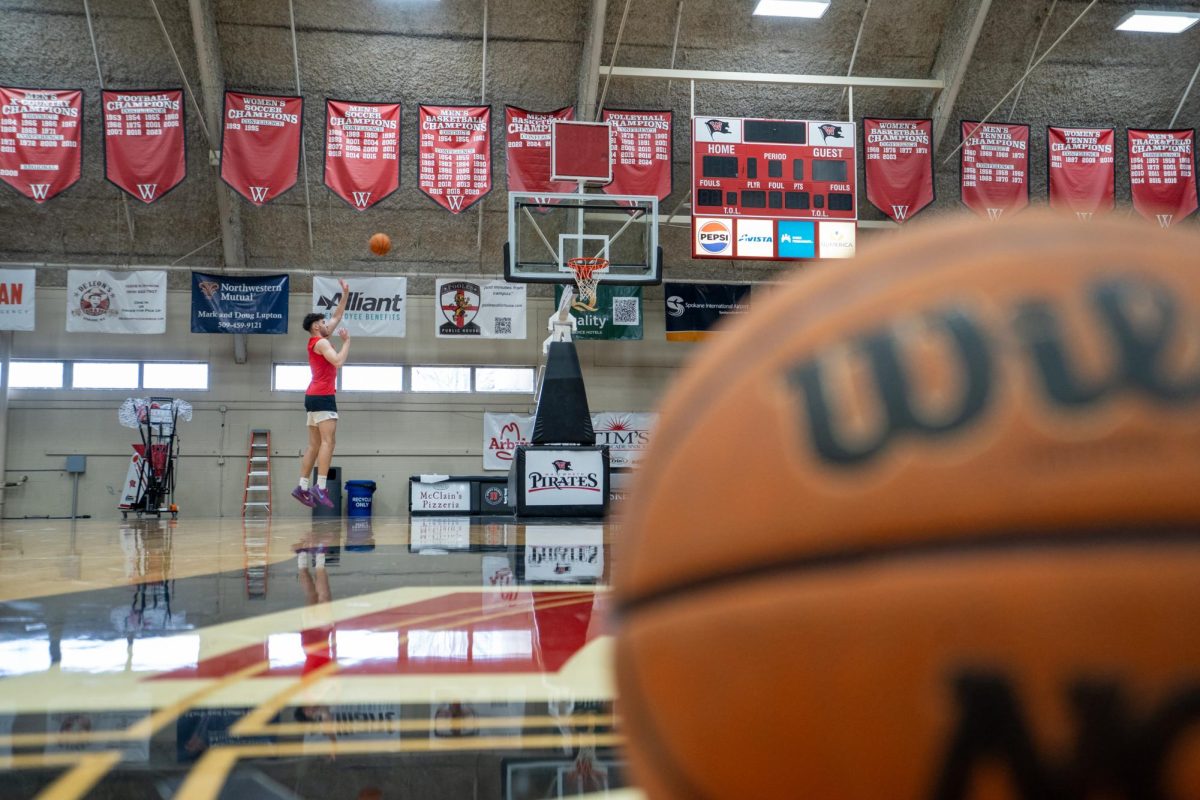 Whitworth basketball player Stephen Behil takes a shot inside of the Fieldhouse Center at Whitworth University, Monday, March 17, 2025, in Spokane, Wash. | Gana Battumur/The Whitworthian
