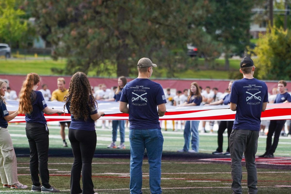 Members of the military hold the American flag for the National Anthem, Saturday, Sept. 30, 2023, at the annual military appreciation football game against Pacific Lutheran University at the Whitworth Pine Bowl in Spokane, Wash. | Caleb Flegel/The Whitworthian