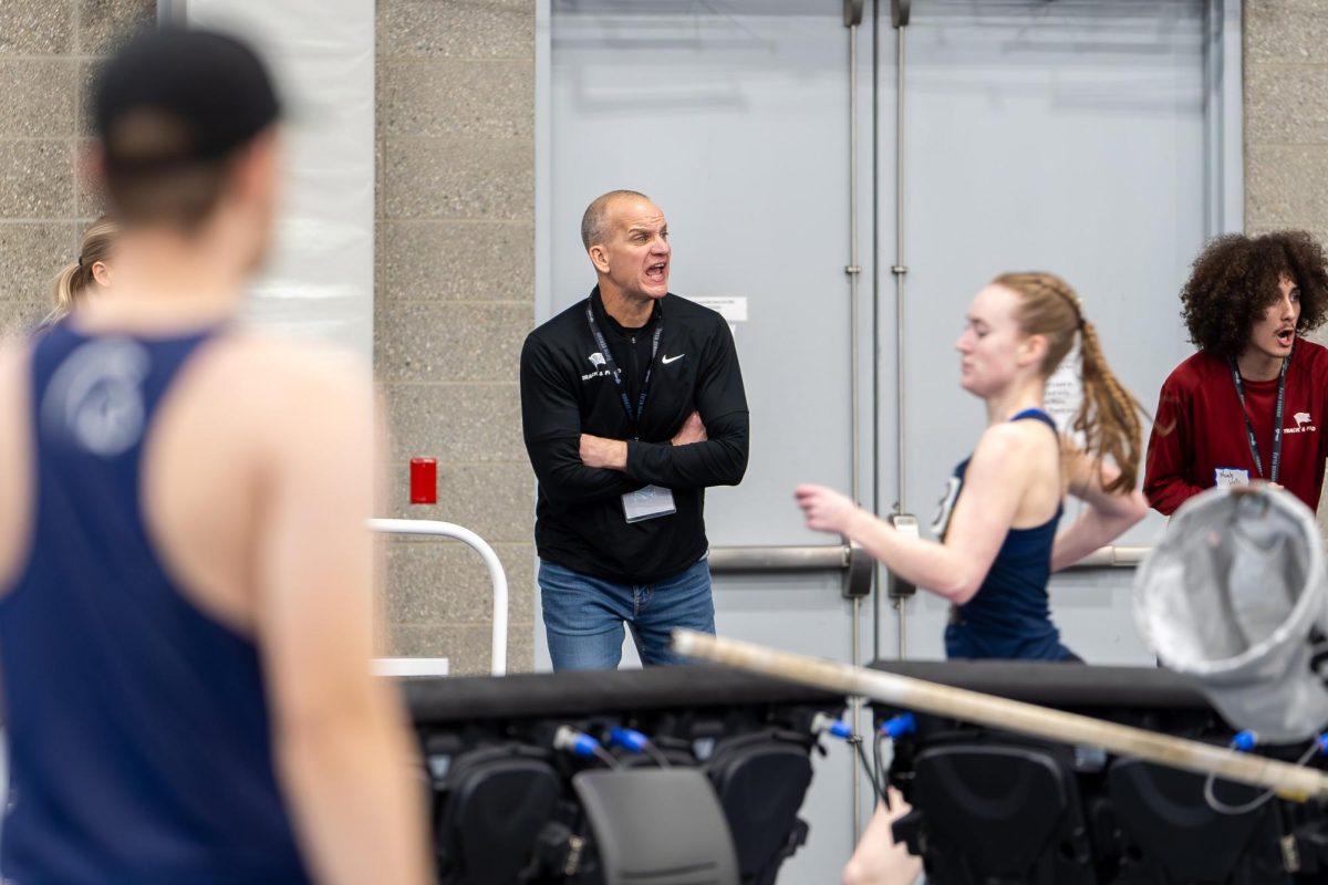 Whitworth track and field head coach Toby Schwarz motivates passing pirate runners, Saturday, Feb. 1, 2025 at the Podium in Spokane, Wash. | Photo by Caleb Flegel, courtesy of Whitworth Athletics