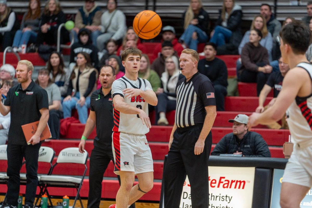 Whitworth guard #0 Garrett Long makes a pass to a teammate, Saturday, Dec. 7, 2024, at an NCAA Men's Basketball game against Hardin Simmons University at the Whitworth Fieldhouse in Spokane, Wash. | Photo by Caleb Flegel, courtesy of Whitworth Athletics
