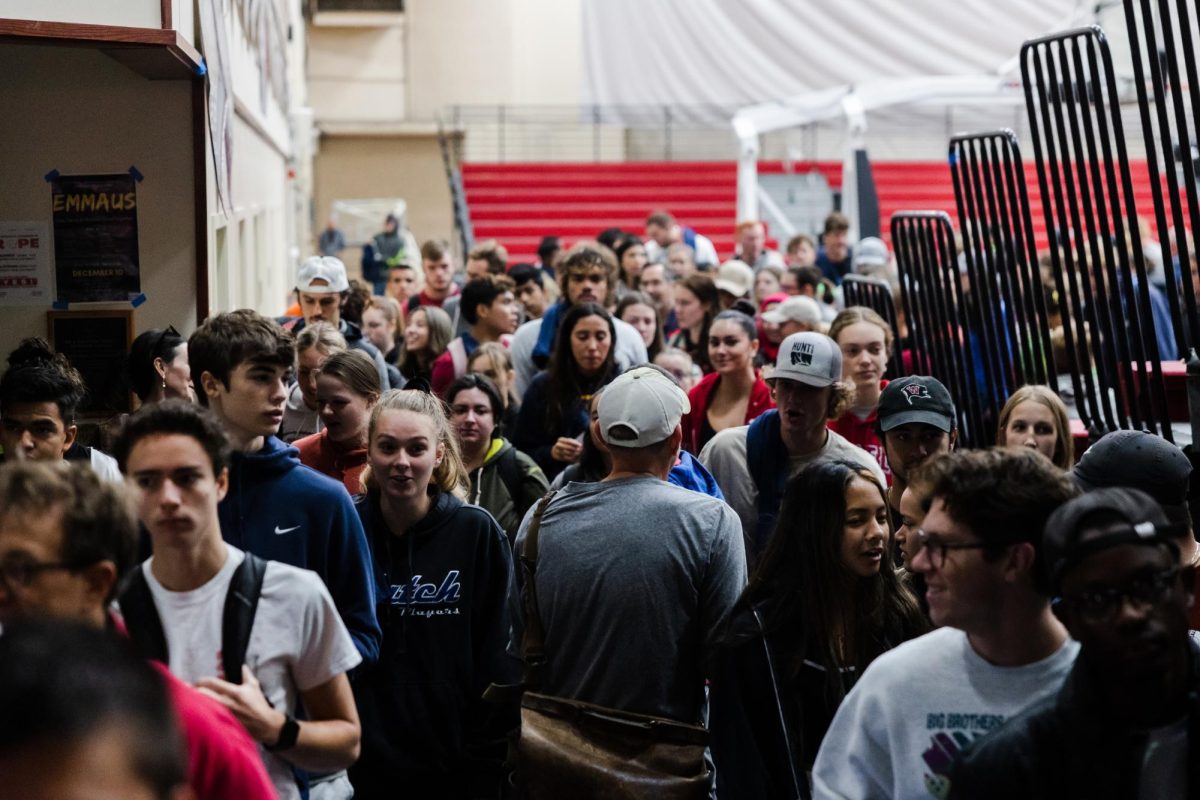 Whitworth students move toward waiting busses for Community Building Day, Wednesday, Sept. 28, 2022, at Whitworth University's Fieldhouse in Spokane, Wash. | Mario Gonzalez/The Whitworthian