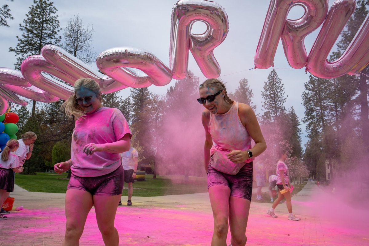 Participants cross the finish line during the 5K Color Run, an event hosted by Whitworth ASWU at the Loop at Whitworth University, Saturday, April 26, 2025, in Spokane, Wash | Gana Battumur/The Whitworthian