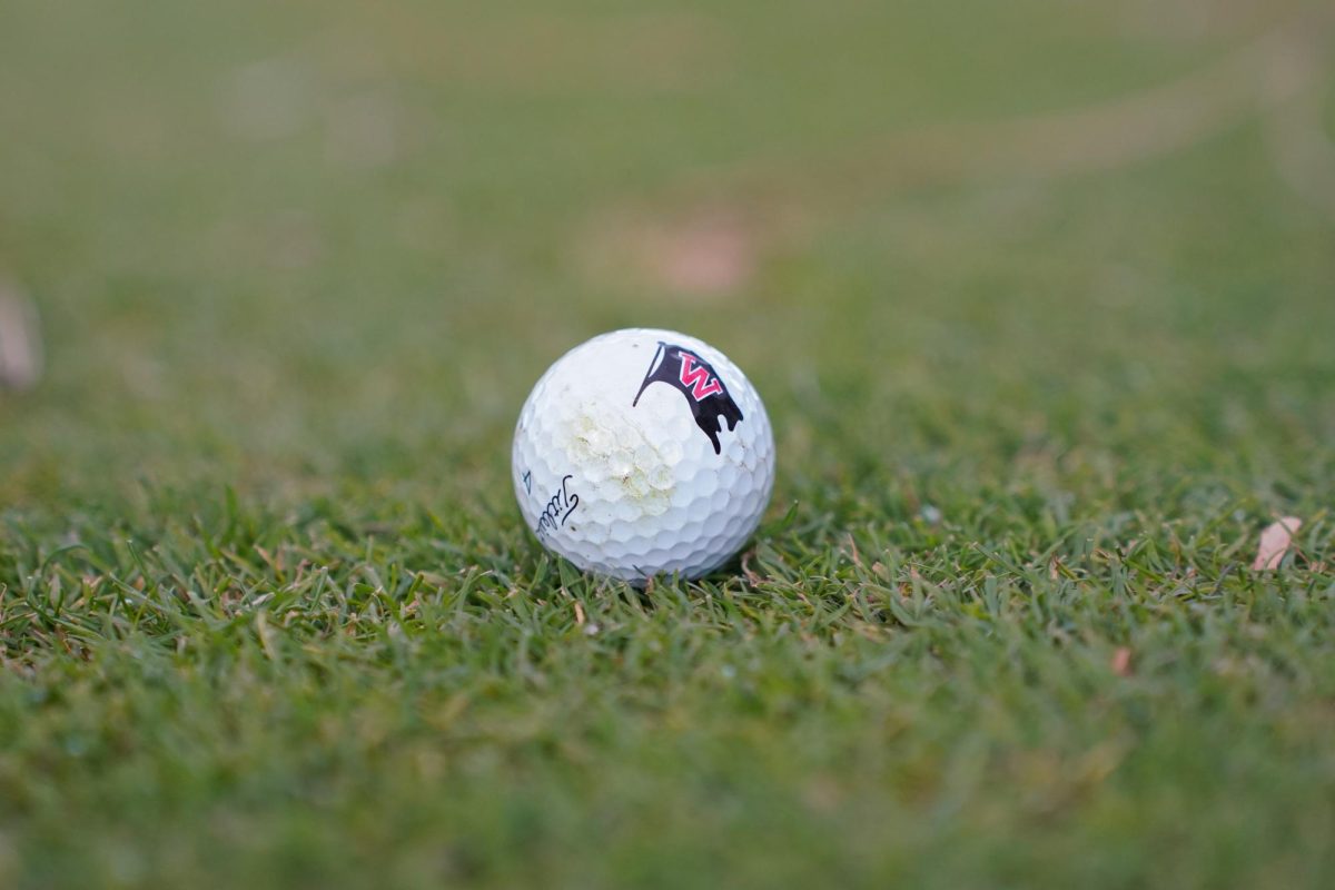 A Whitworth golf ball is photographed at Kalispel Golf and Country Club, Friday, October 17, 2025, in Spokane, Wash. | The Whitworthian/Madison Stoeckler