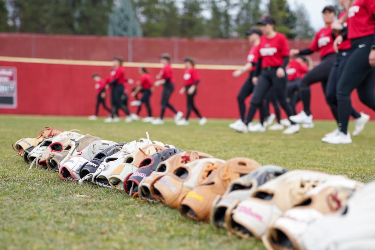 The softball team warms up on Mark’s Field at Whitworth University Thursday, March 19, 2025, in Spokane, Wash. | The Whitworthian/Madison Stoeckler