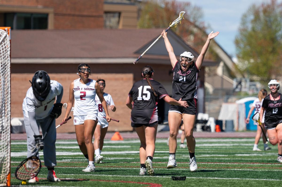 Mary Penfield (left) and Campbell Vincent (right) celebrate after scoring a goal during the game versus Puget Sound at Whitworth University, Friday, April 24, 2026, in Spokane Wash. | The Whitworthian/Lydia Froescher